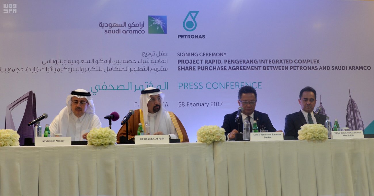H.E. Khalid Al-Falih and Amin Nasser with officials from Malaysia's Petronas at a signing ceremony for a massive $7b deal. 