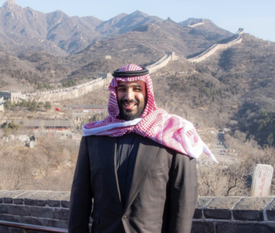 Crown Prince Mohammed bin Salman stands atop the Great Wall of China.