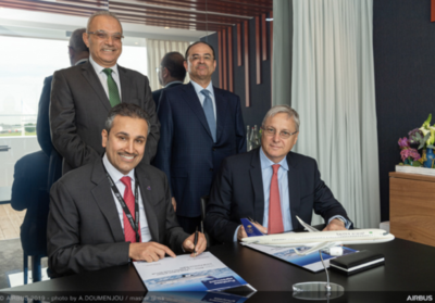 Representatives from Saudia and Airbus sign the agreement at the Paris Airshow.